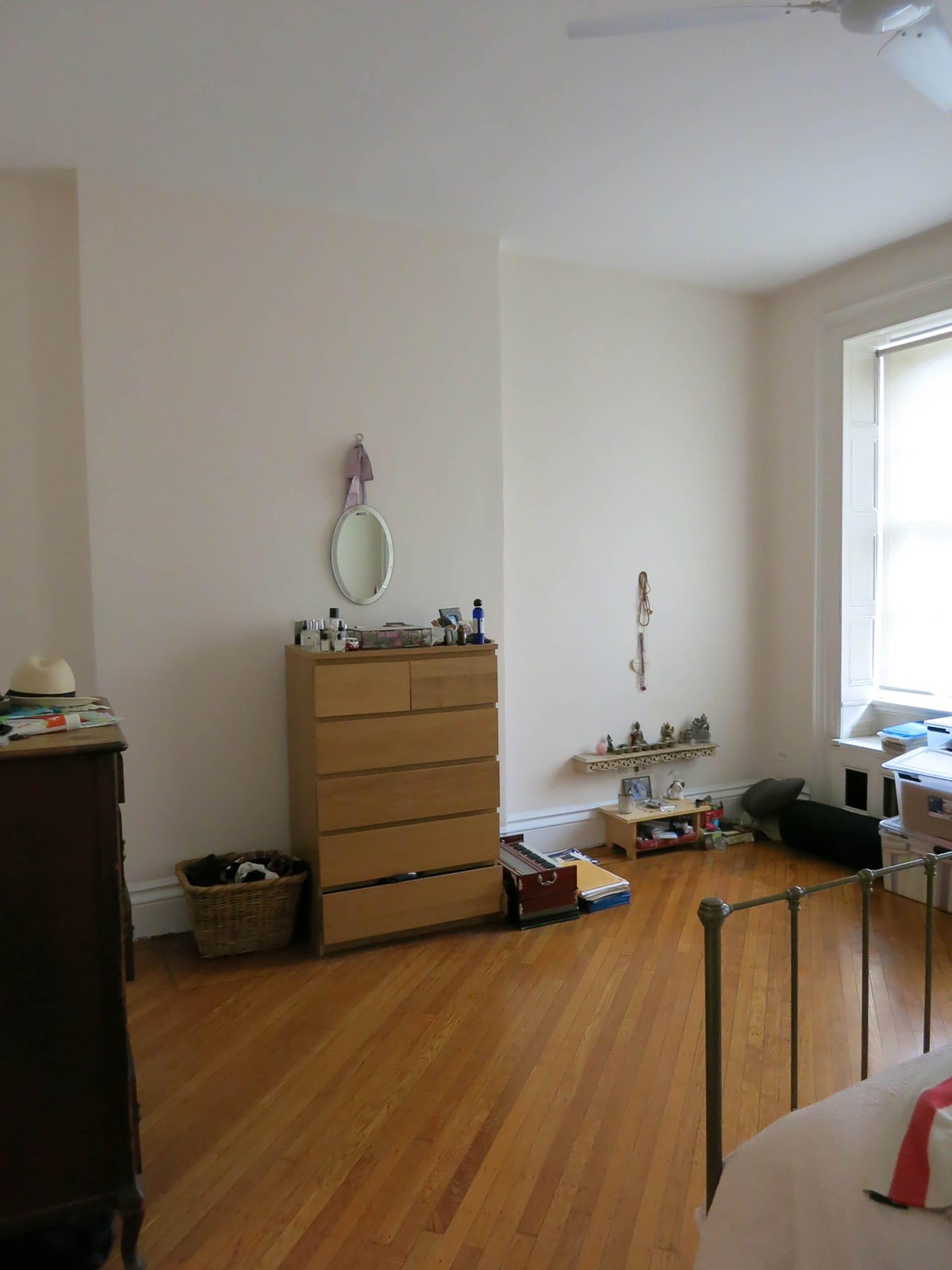 Spare room in a Clinton Hill townhouse with diagonally placed wood floors